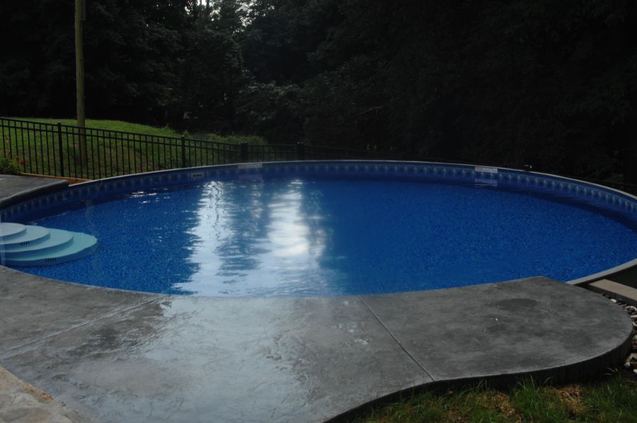 Completed above ground pool installation with integrated outdoor access